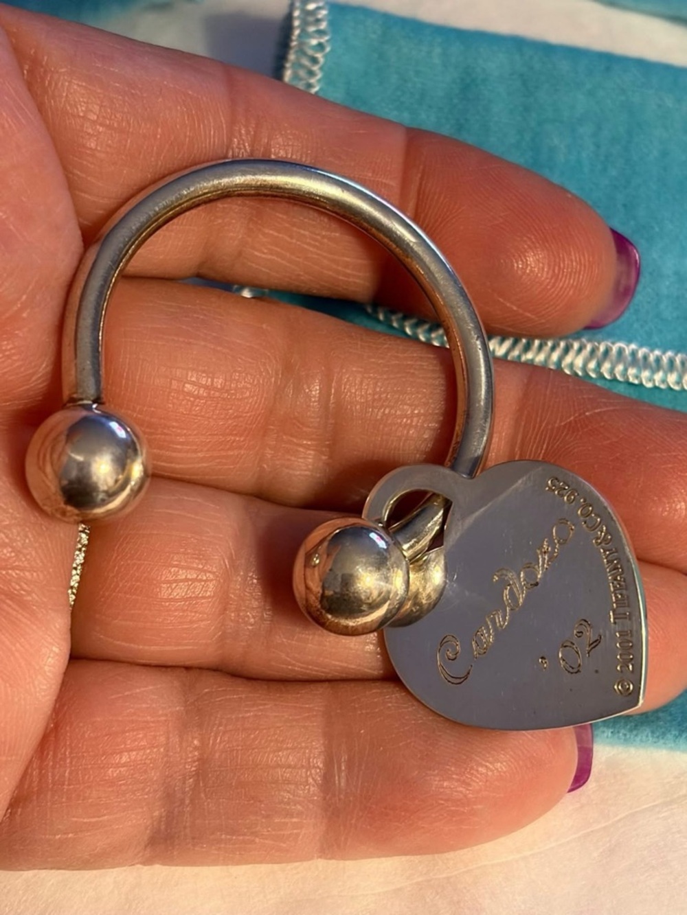 Tiffany & Co. large Silver Heart Tag keychain  on Blue Pouch